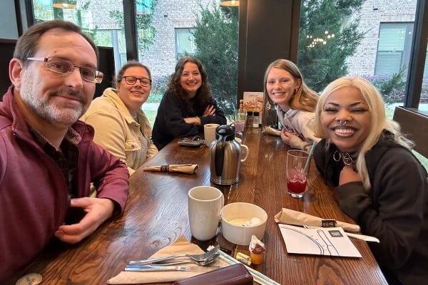 SU Film Majors enjoy breakfast with Joseph P. Genier, Executive Producer of the Paramount+ show, “Wolf Pack,” premiering this January. Elijah Immanuel, Rachel Apostolico, Madelyn Claire Turner and Shannon Forbes have spent the week as interns on the show, experiencing life on set in the professional film and TV world.