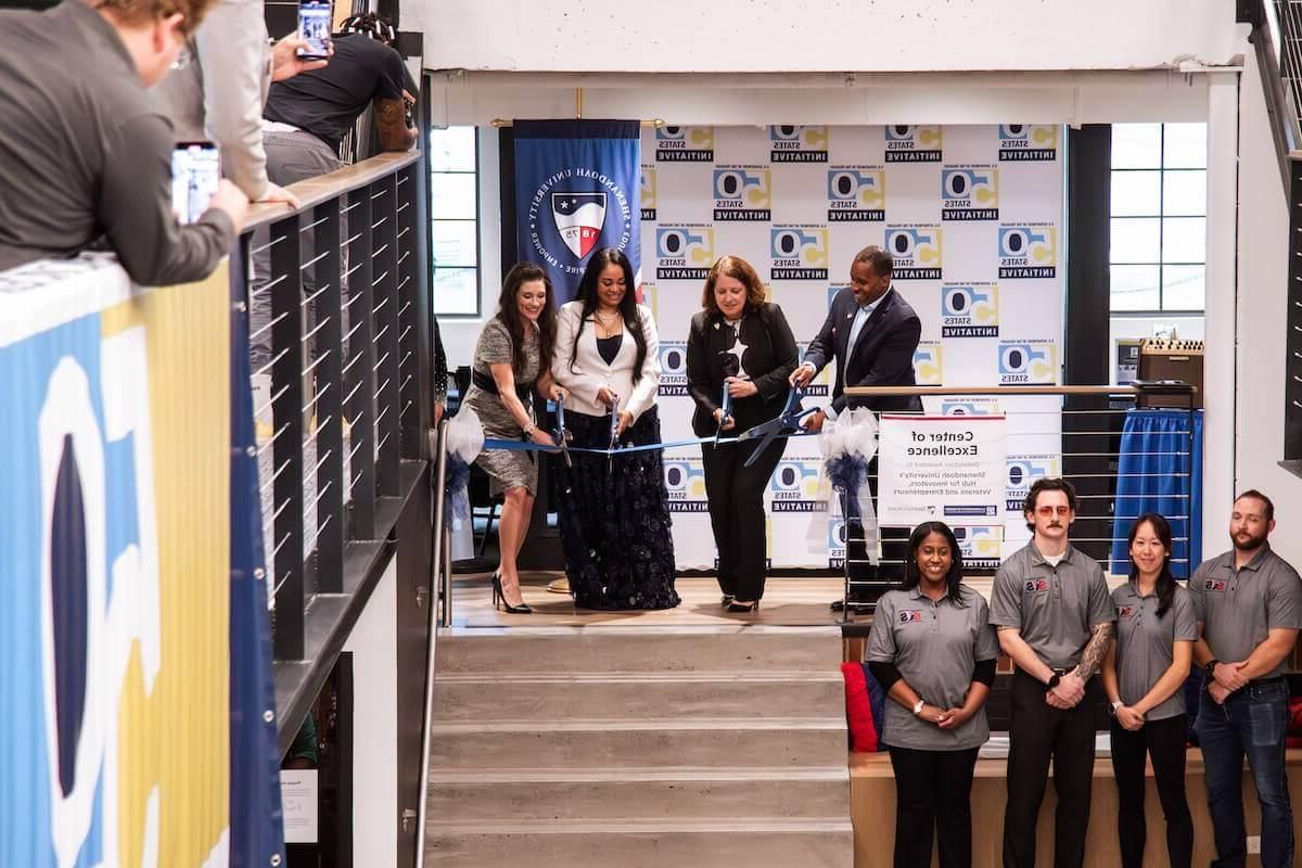 Representatives from Shenandoah University and the U.S. Department of the Treasury cut a ribbon inside the Hub for Innovators, Veterans and Entrepreneurs.